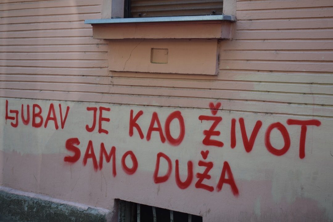 Red graffiti on a building wall